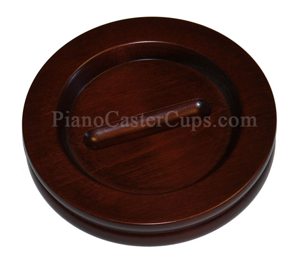 three large grand piano caster cups